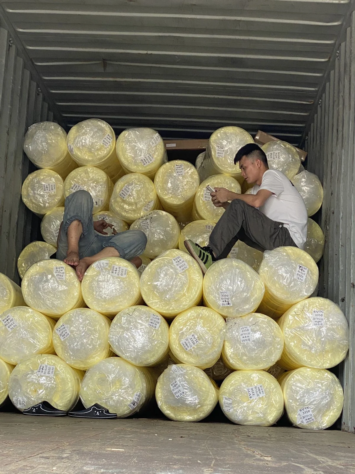 Bulk foam rolls loaded inside a shipping container